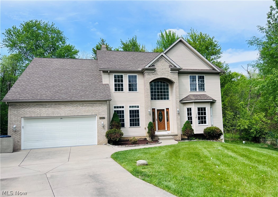 Don't miss the opportunity to own this beautiful updated colonial in award winning Solon School district. Step into 2-story foyer with study on one side and formal living with Bay window and arched dining on the other side. Large eat in Kitchen is updated with quartz counter tops, modern stainless-steel appliances, light fixture, newer sink and faucet. The kitchen seamlessly opens into the family room and sun room making it ideal for entertaining. The family room is highlighted by gas-burning fireplace, built-in speakers and recess lights. A half bath and separate laundry room complete the 1st floor. Upstairs, discover a spacious primary bedroom with flex space that can be a sitting/nursery/office and a large walk-in closet. Relax in the ensuite bath which includes skylight, dual vanity, jetted tub and separated shower/toilet. Three more spacious light filled bedrooms and a full bathroom with skylight await on the second floor. Partially finished lower level offers 3rd full bath, flex room that can be a 5th bedroom, egress windows and walkout add versatility to the home providing ample space for family or guests. The picturesque wooded backyard and tiered deck provide so much opportunity for enjoyment and entertainment. Updates include: whole house interior paint, LVP floors on the 1st floor, newer carpet on 2nd floor, light fixtures to name a few. From its serene location on a cul-de-sac street to its spacious interiors, this home is ready for its next owners. Schedule an appt to see it for yourself and make this one of a kind custom home yours!