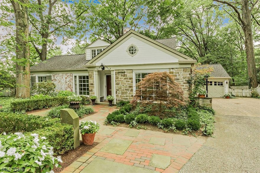 Fall in love with this Great Cape Cod across from Shaker Lakes on a lovely wooded half acre lot!  What's to Love?  The beautiful hardwood Floors and Custom Built-ins Throughout, a fully equipped Gourmet Kitchen with Top of the Line Appliances, An Adjoining Spacious Great Room that accommodates a Casual Eating area and a Wall of Windows with Spectacular Views and Access to the Rear Yard and Patio,  3 Woodburning Fireplaces, A Stunning Master Suite on the First Floor, Three Bedrooms and 2 full Baths on Second Floor, a Library/Office that been customized with Built-ins, a Rec Room that has a WBFP and Wet Bar, an Attached Garage with a 3rd bay for a Workshop and Storage!  Whether you're Growing or Downsizing, this Floor Plan can work for all Life Styles and Needs. Don't miss seeing this Great Home!