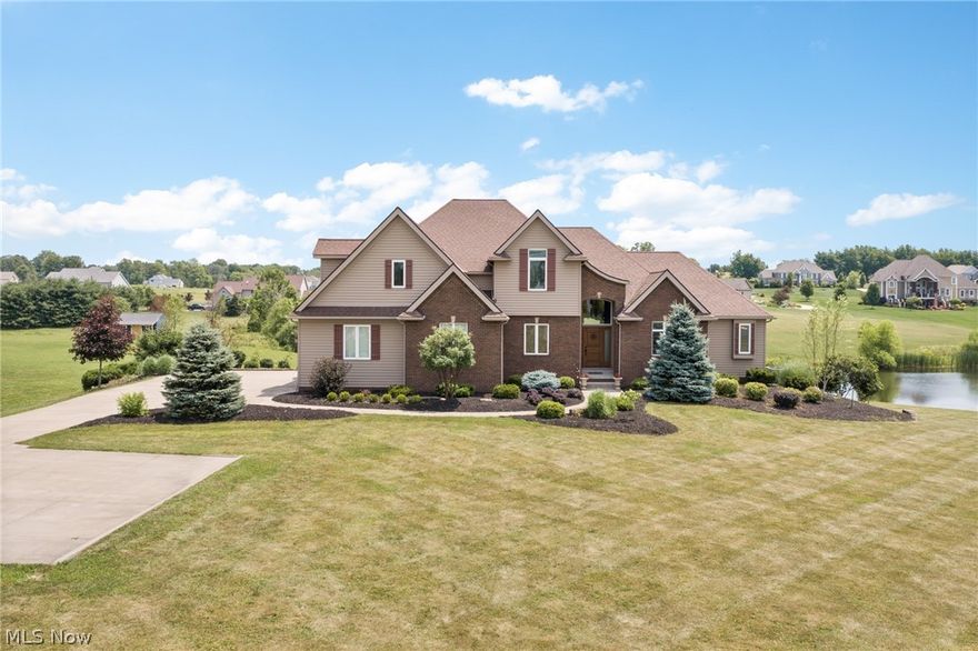 Custom built with superior craftsmanship, immaculately maintained 4/5 bedroom, 4 bath home sits on a serene 2.1 acre lot with lake and country views. Upon entering you are greeted by light filled rooms, large windows, and 10ft ceilings throughout. Gourmet eat-in kitchen features granite counters, custom cabinetry, countertop range, double built in ovens, breakfast bar and opens to great room & dining room making it perfect for entertaining. Great room is highlighted by a wall of windows with views of the lake & floor to ceiling stone fireplace with extended hearth. Nicely sized master suite & spa like master bath provide a relaxing owners retreat. Master bath features his & her vanities, walk in tile shower for two, jetted tub and a substantial, customized walk-in closet. Sizable office can be used as 5th bedroom, half bath & laundry room finish the first floor. Second floor provides 3 nicely sized bedrooms with large closets, 2 baths with granite counters, custom cabinetry, and a siza