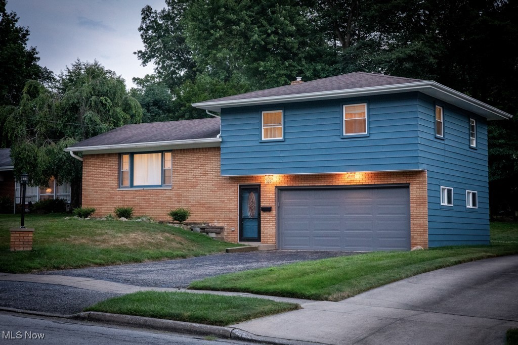 Fully-renovated and move-in ready, this home sits on a quiet, tree-lined street and is ideally located minutes from both Kent State and downtown. Inside, refinished hardwood floors and woodwork add charm and warmth. The kitchen features KraftMaid maple cabinets and plenty of storage. The main bathroom includes a surround tub with a temperature-controlled faucet, Bluetooth-connected exhaust fan with speaker, and a modern vanity. A half-bath is conveniently located near the family room. Ceiling fans in all bedrooms, blown-in insulation, and newer windows improve comfort throughout. Other recent updates include: exterior paint (June 2025), Interior paint (December 2024), Garage door opener system (February 2025), improved exterior drains (June 2025), Outside, the attached two-car garage opens to a shaded backyard and a covered patio. A well-cared for home with thoughtful improvements in a walkable neighborhood close to everything Kent as to offer. Call to schedule your private showing before it's gone!