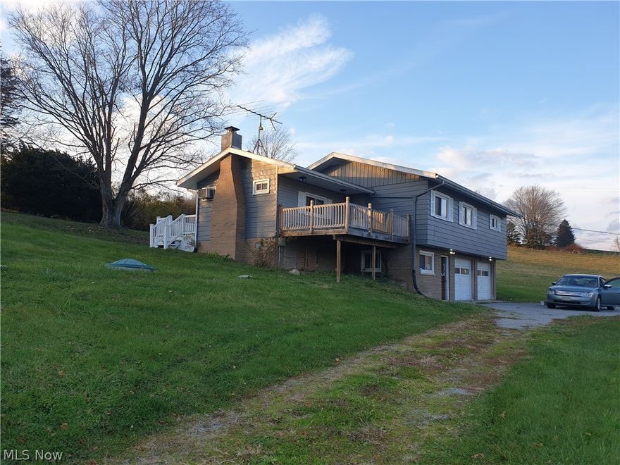 Enjoy amazing views from your front porch and total serenity from your back porch! This is a 3–4-bedroom ranch house with a 2-car garage in the basement. The house has well-sized rooms and a living room with a working fireplace. The kitchen has been remodeled with J COLLECTION cabinets and Butcher Block Acacia Countertop. New premium slate-colored appliances are included! The house received a brand-new water heater and updated plumbing. A trampoline does as a bonus:)