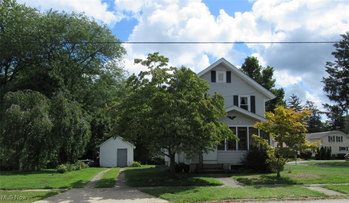 This three bedroom colonial features beautiful woodwork adding character throughout, built ins, half bath on main level and a big, full bath upstairs near the spacious bedrooms. The dining room is open to the living room. The enclosed front porch offers additional living space. The roof is about 10 years old, furnace and A/C about 2-3 years old. There are hardwood floors under the carpet in the bedrooms. The basement offers additional storage. Situated on a .33 acre lot with an additional driveway on Vine St. 12 x 18 garage/outbuilding. All appliances stay including freezer in the basement. Being sold AS IS with no repairs made by seller.