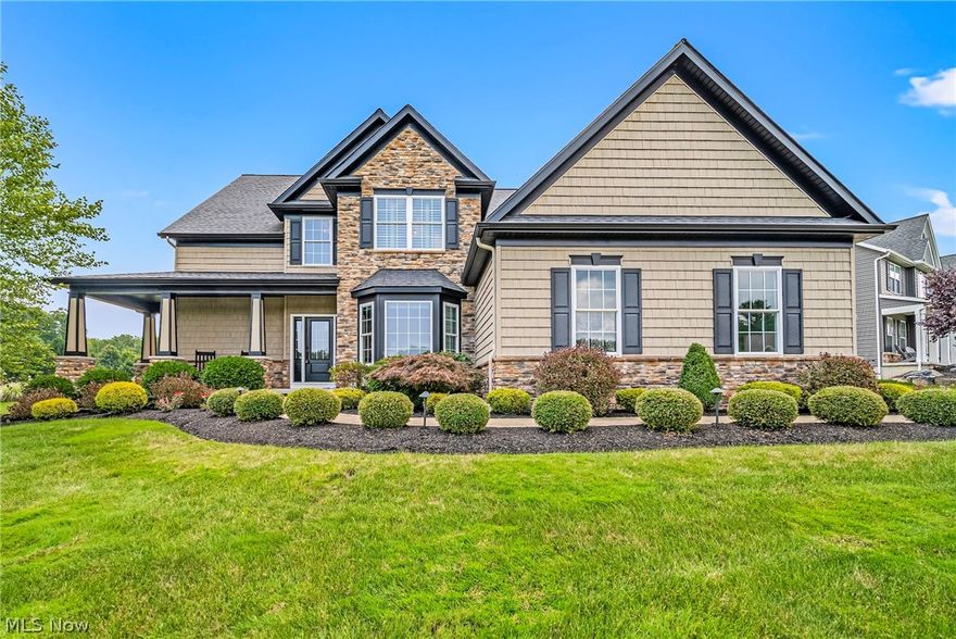 Experience luxury living with this 2016 YMCA Dream House, boasting top-of-the-line finishes and meticulous design throughout.  Each room has high end finishes and its own unique design. Covered wrap around front porch, entering into an open concept soaring 2 story great room with vaulted ceilings, custom floor to ceiling handcrafted stone gas fireplace, coffered ceiling and wall of windows with plantation shutters. Open gourmet chefs kitchen with high end SS appliances, quartz counter tops, custom white cabinetry with built in hood fan and wrap around breakfast bar. Mosaic handmade tile on backsplash, pantry, dining room off kitchen with sliding glass doors that leads to screened in porch as well as a paver patio with fire pit and built in gas grill. Wrought Iron fence makes this an entertainers dream! 1st Floor laundry room with cabinetry and office off the foyer. 1st floor master suite with glamour bath equipped with claw tub on mosaic tile flooring, custom frameless glass ceramic tile shower, his/her vanity with quartz counter tops. 3 bedrooms up one of which is a huge bonus room or guest suite with private bath. 2 additional bedrooms one attached to the 3rd full bath with quartz countertops. Full finished lower level features kitchen/bar with sink, wine fridge, built in wine rack, quartz wrap around bar top opening to the huge rec room. This home has a 3 car garage with storage lift, finished flooring, built in workshop and yard tool organizer, security system, and lawn irrigation system. A true entertainers dream!