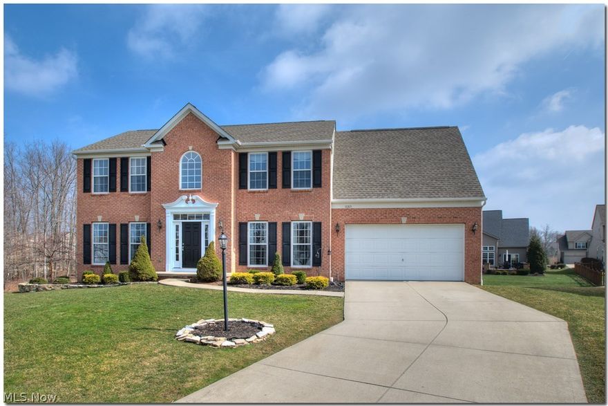 Newer construction home on a cozy cul-de-sac.   Back yard backs up to private wooded wetlands area that cannot ever be built on.   Kitchen complete with appliances and granite countertops, and an eat in area with plenty of windows for natural sunlight.   Vaulted ceilings in master bedroom, complete with master bathroom.   Finished basement complete with bar and home theatre!  Wine cooler and beverage coolers both stay.  Great floorplan, neighborhood walking paths, move in ready home awaits! Twinsburg schools!