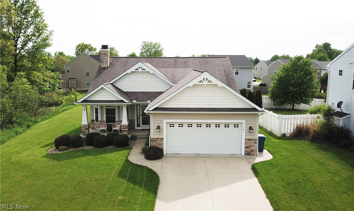 Welcome to 4179 Pembroke Drive! This gorgeous Stonehaven Homes custom built ranch is located in the desirable Sterling Green Development and provides all the amenities you need! Beautiful maple kitchen with window cutout looking over your living room. Living room boasts a fireplace and surrounding windows providing loads of natural light. Owners suite includes large bedroom and owners bath with tub, shower, walk-in closet, and double sink vanity. Upon entry from garage you will find a main level laundry room w sink, storage cutouts, and cabinet space. 8.5' ceilings. Clean and well-maintained full, unfinished basement that has plumbing for a bathroom. Vinyl/stone/shake exterior with front and back covered porches. Large backyard with vinyl fence. Schedule your private viewing today!