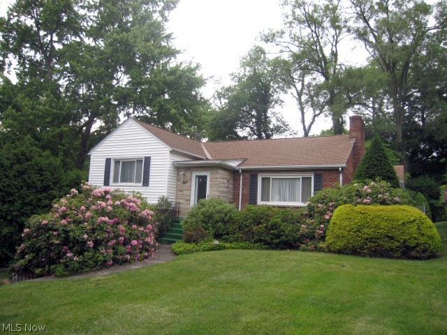 Don't miss out on this unique property located on a "dead end" street of fine homes on beautiful lots. This home is no exception! This Raised Ranch has four steps up to master, 2nd bedroom and full bath from living room. There is a 3rd bedroom (*public record is at 2 bedrooms) and full bath on the lower level along with a family room. There's also a large unfinished basement area loaded with storage. The living room is unbelievably massive and features a gas/woodburning fireplace and nice sized formal dining room. Off the dining room is a patio enclosure that leads out to gorgeous private & fenced back yard. The kitchen is really large and loaded with cabinets and all appliances stay, including washer & dryer. The attached garage is heated by gas and has two service doors to lower level (both finished & unfinished areas). Roof is dimensional shingles and was installed in 2000 with 25 year shingles, all windows are replacement vinyl and a new hot water tank in 2015. In May of 2016, the