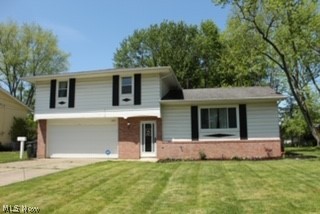 Updated and move in ready. Welcome home to this 4 bedroom one full and two half bath colonial. This home is perfect for entertaining. Large foyer with ceramic tile which leads into the open concept living room, dining room and kitchen. The kitchen has newer cabinets and stainless appliances that convey with the home. The large living room has a picture window and recessed lighting. Large Master bedroom with half bath plus 3 additional bedrooms on the second floor. The basement was waterproofed in2015, full basement is partially finished. This home has new windows, hot water tank, central air and garage door. This beauty wont last