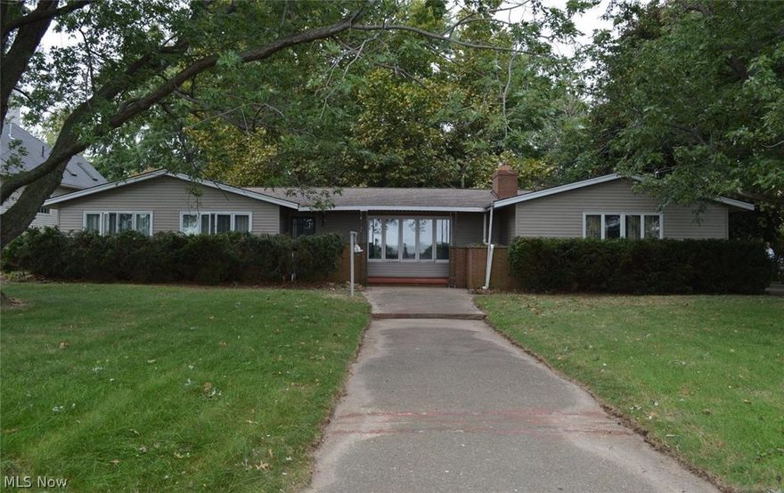 Make This Baby Your Own! This ranch style home boasts of a 1+ Acre Lake to Bay lot on Sandusky's Cedar Point Chausee approximately one mile from the Amusement Park. Storage cabin with fireplace has unlimited possibilities. Work needed but what do they say? Location, location, location!