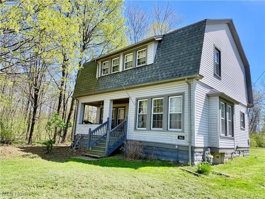 Nestled in a serene, quiet setting, this delightful three bedroom Colonial home offers timeless character and modern comfort. This home features natural hardwood beamed ceilings and a beautiful stone fireplace in the expansive living room, perfect for relaxing or entertaining. The formal dining room is ideal for gatherings, while wood floors throughout the first and second floors add warmth and charm.  There are three bedrooms and a full bath on the second floor.  Additional features include a new dimensional shingle roof, new furnace & central air unit, new electrical panel,  a 2 car detached garage and a generously sized lot with room to roam. A rare find in such a peaceful location while not being far from shopping, restaurants, and entertainment.  With some cosmetic tlc this home will be amazing!