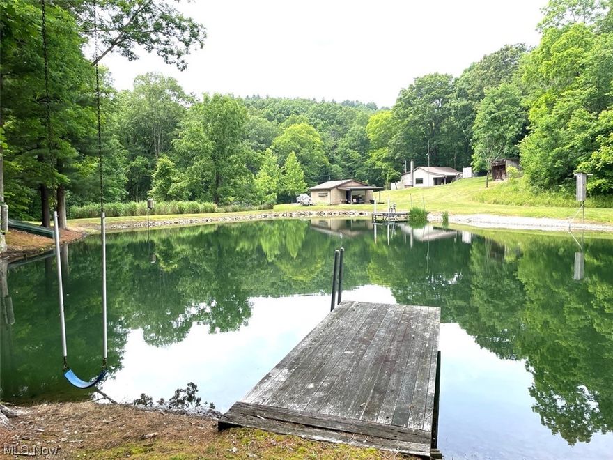 Get-A-Way Retreat - Ranch Home - Lake – Woods - 5.75 Acres - Carroll County - Live And Online Bidding Available - Sellers are moving south. ABSOLUTE AUCTION, the property will sell to the highest bidder on location. ONLINE BIDDING BEGINS SUNDAY, JULY 30, 2023 – 6:00 PM and AUCTION LIVE ON-SITE BIDDING WILL BEGIN WEDNESDAY - AUGUST 2, 2023 - 6:00 PM. Quiet rural setting! Well-maintained property featuring cozy ranch home has two bedrooms, two full baths, kitchen with appliances, laundry, and family room with wood burner. Electric heat, new windows 2022, and metal roof. Walk out to the covered rear porch and hot tub. Detached 24’ x 32’ garage with new roof, electric, wood burner, water, and covered rear porch overlooking the lake. Stocked spring-fed lake with two docks and swings. Another small shed with a new roof, outhouse, and playhouse up in the woods. Situated on 5.75 acres with nice, cleared walking trails in the woods for hunting and recreational use. Current taxes are $870 per ye