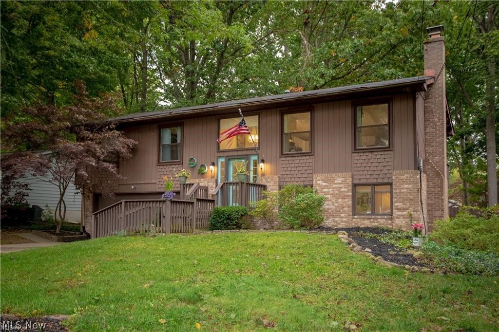 Beautiful fully renovated 4 bedroom 2.5 bath home in desirable Monroe Falls. Walk into a gorgeous brand new open concept kitchen with quartz counter tops, subway tile back splash, new stainless steel appliances, and new wood floors. Also, newly renovated bathrooms, new carpet in the bedrooms. Second family room in lower level with a fireplace and new wood floors throughout. Relax outside on the double back deck that over looks the fenced in backyard and fire pit. New furnace and water tank. Don't miss out, this mid-century modern home won't last long!