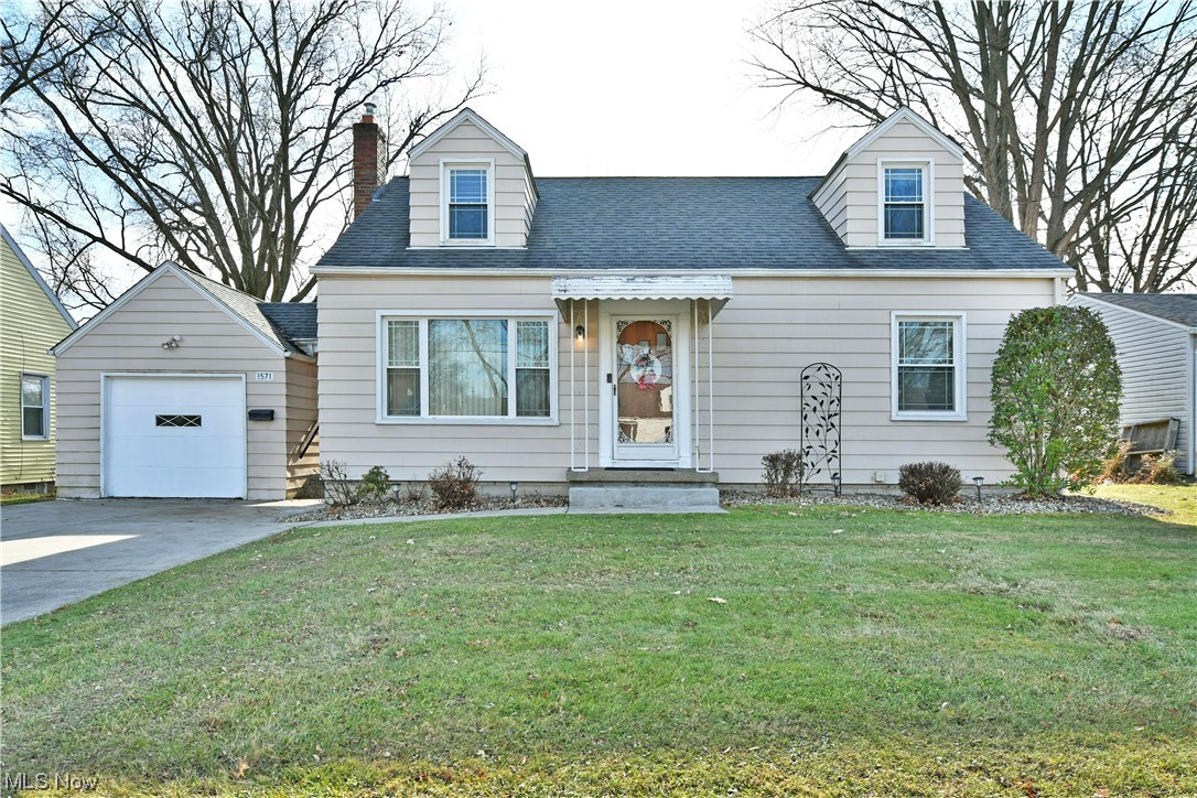 With three floors of finished living space and a fantastic, fenced in backyard; this lovely Cape Cod has everything you’ve been looking for! An appealing exterior packs plenty of curb appeal with its well-kept appearance easily echoing its matching indoor views. A detached single car garage awaits the end of the concrete driveway while a pair of dormer windows overlook the front yard from above. Meanwhile, a brick laid patio space is outlined in additional stonework for easy relaxation around back. Through the front door, a carpeted living room is awash in the natural light courtesy a large picture window. Around the corner, an equally illustrious dining room adjoins the substantial kitchen with its stained wood cabinets, piano black appliances and hardwood styled flooring. Further down the main hall, a brightly lit bathroom provides outstanding tile work and a vanity. The pair of first floor bedrooms are trimmed in warm hardwood as they feature multiple windows. On the second floor, a third bedroom spans the remaining footprint outside the stairway landing. The finished basement includes both a second full bath and ample laundry services.