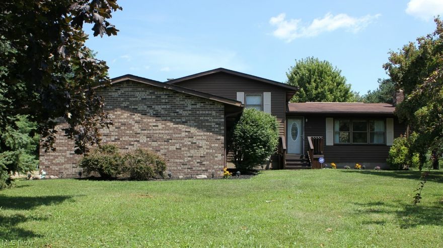 Welcome to Country living in this bright and spacious split level home located on a quiet street.   Meticulously maintained home has a large living room which flows into the eat in kitchen and dining room that has sliding doors out to backyard deck.   Family room includes brick full wall wood burning fireplace with barn wood mantel.   Office with updated full bath is also located on lower level.    Upstairs includes Master bedroom with 2 large closets,  2 additional bedrooms with tree views and a remodeled full bath.   

Mature trees surround the over 1.5 acre lot with pool and large updated back deck.   The 24X32 barn with 10' ceiling is large enough for all your storage and a perfect work shop.   Home also includes security system and a wood/coal burning supplemental heating system to save on winter heating bills.