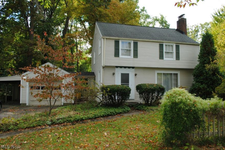 This lovely vinyl-sided Colonial style home features three bedrooms and one bathroom. Oak hardwood floors throughout, with a hardwood hickory floor in the spacious family room. This home has a galley kitchen, formal dining room with ceiling fan; in the living room there's a wood burning fireplace (the previous owners did not use). The master bedroom feature two large closets and a ceiling fan; the second bedroom is spacious as well, and the third bedroom can be used as a den, nursery or office. This home also features a full basement and tandem garage of extended length for two cars. All this in a beautiful, peaceful park-like backyard setting with large deck off the family room. Well water with city water at the street the new owners can tie into. This home has been freshly painted throughout and is in immediate move-in condition. Home sold as is.