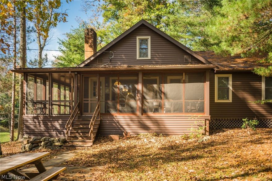 AUCTION, on site: Tuesday, Nov 22nd. A pristine real estate offering with a setting one must see to appreciate! This 54 acre hideaway is tucked at the end of long driveway and features everything you look for in a property with acreage. The bungalow home features a screened in, wrap-around porch, 3 bedrooms, full bath, kitchen, living room with fireplace, full walkout basement, with utilities being electric baseboard heat, wood burner, well & septic. Additionally the property features 3 rustic cabins (1 from Zoar Village) nestled around & overlooking the 2 to 3 acre lake. The 600 sq. ft. pavilion area is outfitted with electric & lights along with a brick wood fired grill area with rotisserie perfect for entertaining. There is a 30’x50’ pole building & an additional storage barn to house all the equipment & toys. The land features mostly woods with trails throughout for easy access across the entire property. The land is flush with wildlife and the lake is fully stocked making this an