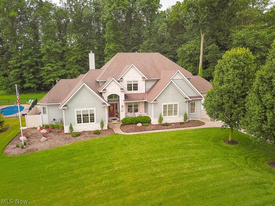 Impressive Stone Ridge Beauty/Quality Olmsted Falls Schools/Newer ingound Salt water heated pool... Totally Custom & Gorgeous Throughout w/glamour first floor owner's suite/also 2nd flr master on a premium treed cul-de-sac 4 acre lot in upscale community. Perfect in & out with absolutely no expense spared. Attractive approach w/deep set back/4 car heated garage/rear yard access. Enter to soaring ceilings w/dramatic curved staircase/iron spindles! True custom contemporary kitchen (Leaded Glass), granite, Proline KitchenAid (warming Drawer/wall ovens)...views from huge morning room of private treed lot/paver & stamped concrete patio/covered area. Extreme detail...Italian tiled fireplace in 2 story great rm, large banks of windows/remote blinds, Jack-n-Jill bath, 10FT+ ceilings, Owners bath w/granite/glass shower/body sprays/oversized tub, closet organizers, more. Open stairwell to Finished lower level w/Black Walnut & granite bar, fabulous billiard room, rec area..walk out to garage. Security/irrigation systems. Generator.  All bedrooms w/walk in closets. 2nd flr sitting area. Over $1,000,000K invested!
