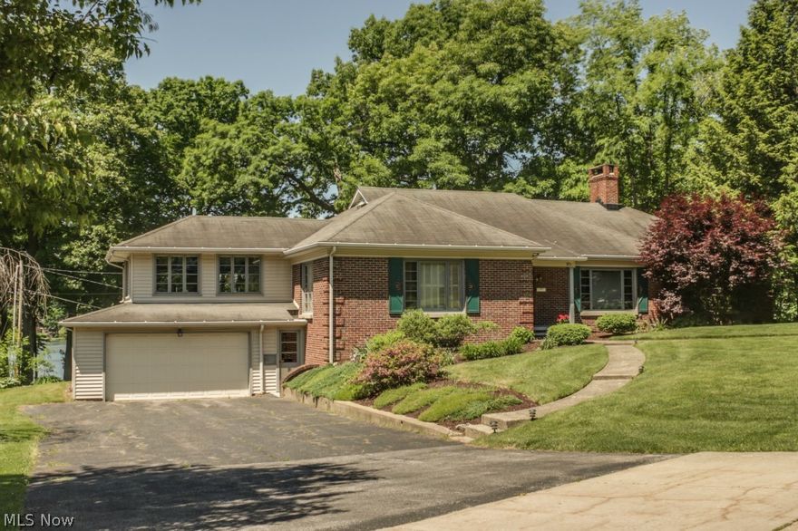 This charming lakeside ranch has breathtaking views of Silver Lake. It features a large master bedroom that is private from the other two bedrooms. There are hardwood floors throughout the upstairs that tie-in beautifully with the knotty pine kitchen. The large windows across the back of the home allows for maximum enjoyment of the lake view. The 2 car garage has a bonus area for additional storage or a workshop. The turned staircase takes you down to the walk-out  basement that has finished living space and a kitchen that's perfect for entertaining. The beautiful stone fireplace will add an additional level of a cottage experience coupled with the exposed wood beams. The sky is the limit. Don't miss out on this rare opportunity!