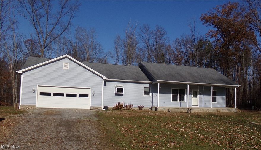 Looking for a home that offers a customized architectural design and sits on 10 wooded acres near Canfield, Ohio?  Then, look no further than this magnificent ranch home on Berlin Station Road that was built in 2003 and has been well maintained ever since.  From the moment you walk in, the spacious and comforting design captures you, with an open floor plan boasting a fireplace in the living room, 9 foot ceilings throughout that peak at 14 foot in the living room along with skylights for natural light.  This beautiful home offers 3 bedrooms and 2 full baths with the master bedroom having its own walk in closet.  The laundry room is located on the main floor, right beside the attached 2 car garage, which also, holds a second entrance to the basement. There is, definitely, no shortage of options on the outside.  You can choose to sit back and take in the peace and serenity from the covered front porch, relax or entertain on the back deck, where you're surrounded by nature, or take a walk in the woods.  Don't wait. This home is priced to sell! Schedule your private showing today.