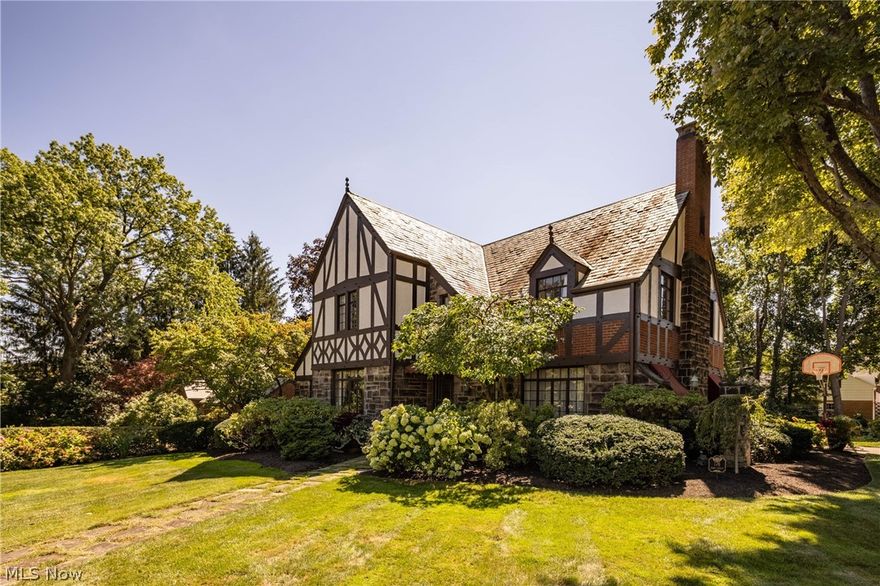 This historic Ridgewood home offers the character of yesteryear with the conveniences of today. Gorgeous brick & stucco Tudor boasts 3644 total sqft, 4 bedrooms, 3.5 baths. Impeccably maintained throughout with slate roof, hardwood floors and historically appropriate updating. Elegant formal living & dining rooms. Cozy wood paneled study opens to a sunlit family room with vaulted ceiling & built-in bar. The cherry kitchen is equipped with stainless appliances, pantry closet and charming eating area. The spacious master bedroom has 4 closets & beautiful ensuite bath.  Two additional bedrooms share another updated full bath & the fourth bedroom has its own dedicated bath. The lower level offers a recreation room with fireplace. The yard is spectacular and very private!! A deck overlooks perfect landscaping with fish pond & one-of-a-kind all brass lawn irrigation system. Hurry to see this beauty!