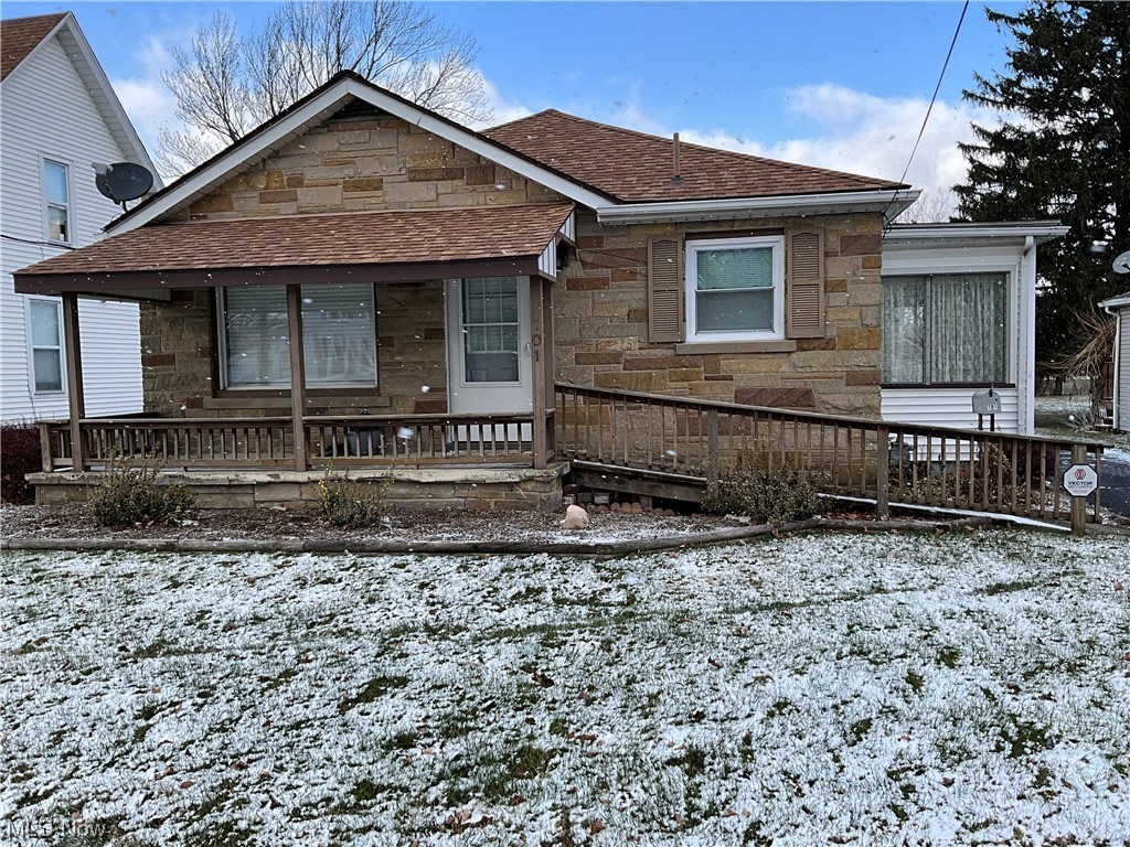 Nice, cozy 3 BR, 1 bath home w/large living room, full basement, 3 season room, attached garage, blacktop drive & storage shed. Nice back yard, covered front porch. Close enough to walk to downtown, the school or library.