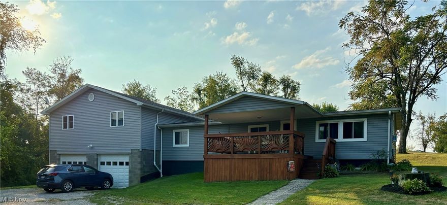Located just minutes from town, this 5 bedroom home is sitting on over an acre of beautiful, expansive outdoor space. This property offers a peaceful setting where you can relax and enjoy watching deer, birds and other wildlife right from your own backyard. Enjoy the peace and tranquility of nature while being 5 minutes from downtown St.Clairsville. Perfect blend of convenience and tranquility. The oversized attached garage is ideal for your vehicles, storage, or perhaps a workshop area. It has a wood burner for those cold winter days and a 1/2 bath. There is also a huge detached garage perfect for car enthusiasts, hobbyists, or those in need of extra storage for their recreational and outdoor equipment. Inside, a large master bedroom offers a luxurious master bath with a spacious soaking tub and plenty of natural light, a double vanity and a separate shower. With an additional 4 bedrooms, there's plenty of options if not needing them all as such. Think guest room, hobby room, playroom, home office space,or home gym. The possibilities are endless. Don't miss this opportunity to own this beautiful home close to all the amenities of town!