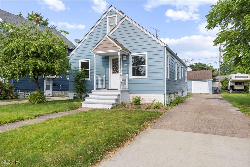 Bright & cheerful bungalow in the desired Poplar Street neighborhood! Located just a few short blocks from public/private schools, parks, shopping and more! Great curb appeal with a recently painted exterior.  Step inside to a beautifully appointed interior has an open concept feel, but not too open! Charming refinished REAL hardwood floors, fresh paint! Beautifully appointed newer kitchen with eating area, modern backsplash, crisp white cupboards, range and refrigerator remain! Bright and sunny rear breakfast nook could also work as a sun/plant room or small den! Two bedrooms and an updated full bath on the main level. The modernized bathroom has a luxurious feel with gold faucets and attractive vanity. There's a neutral and spacious upstairs dormer style bedroom. Full basement for storage. Nice sized lot, concrete driveway and a detached 1+ car garage.