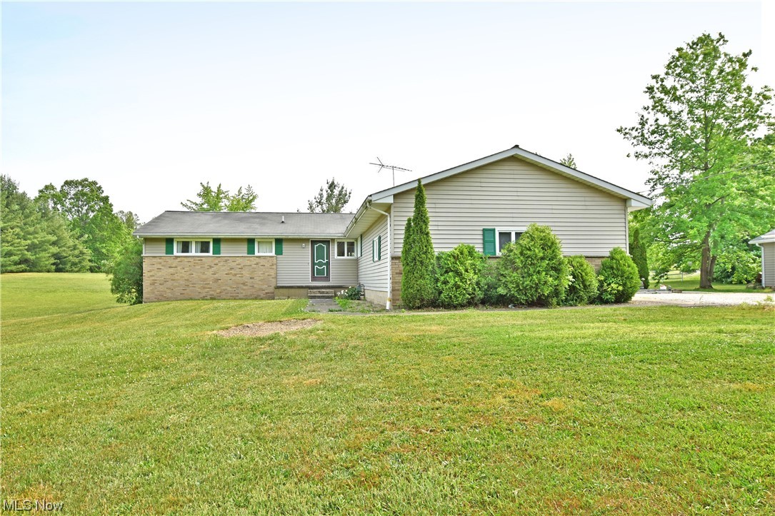An astounding amount of living space placed on an even more impressive property, this stunning
Southington home places you in a semi-rural paradise with two floors of finished living space! Sat at the
end of a long, gravel drive the ranch layout is quick to impress with its massive, detached outbuilding for
easy equipment or vehicle storage along with available shop space. An additional barn hides behind
privacy veiled trees for even more. The unique covered patio space wraps along the side of the home,
ending with a porch swing filled gazebo for taking in warm summer afternoons. Inside, the foyer
branches away into both the kitchen and illustrious central family room as the main hall extends past a
trio of welcoming bedrooms. A charming full bath joins them while the master suite includes its own full
private bath with stall shower. The living room’s bold red fireplace creates a striking focal point as
formal dining awaits the tastefully updated kitchen with its ston