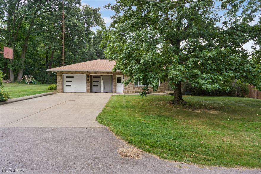 Welcome to 4875 Park Drive in Shreve, Ohio. This wonderful home has all the amenities of in town living while also
providing an incredible lot that is nearly 4 acres big! This brick home has a spacious well laid out first floor and a
finished walk-out basement for a total of 2,200 finished living space. The first floor features a lovely living room with
picture window, a large kitchen with adjacent dining room, both with hardwood flooring, three generously sized
bedrooms, and a large full bathroom. Downstairs is a huge family/recreation room with dining area and a wood
burning fireplace. There is also a full kitchen that comes with appliances, a full bathroom, laundry room and plenty of
storage space. The lower level walks out to a nice patio and the expansive yard space. Outdoors you have plenty of
space to garden, play, take up hobbies, or sneak away to the private yard space over the creek and in the woods.
