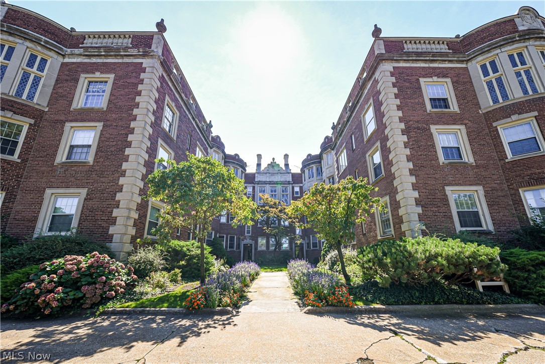 Spacious 2 bedroom, 1.5 bath second floor condo in the historical Shaker Heights Van Aken Towers designed by Alfred Harris (also the architect of Moreland Courts). 26 unit building is meticulously maintained with period architecture and amenities such as on-site custodian, indoor heated garage, storage room, resident garden area, laundry room, elevator and intercom entry system. The unit faces the beautifully landscaped courtyard and has approximately 1,540 sq. ft. with original hardwood floorsand moldings, tall ceilings, an oval shaped living room with wood-burning fireplace, walk-in closet in master bedroom and lots of natural light. The $714 HOA fee covers heat, gas, water, sewer, snow removal, grounds upkeep, offering low maintenance and easy living. One assigned indoor garage space is included and additional spaces are available for an extra monthly charge. Close to the Van Aken District & shopping centers, RTA and convenient access to the Cleveland Clinic, CWRU, University Ci