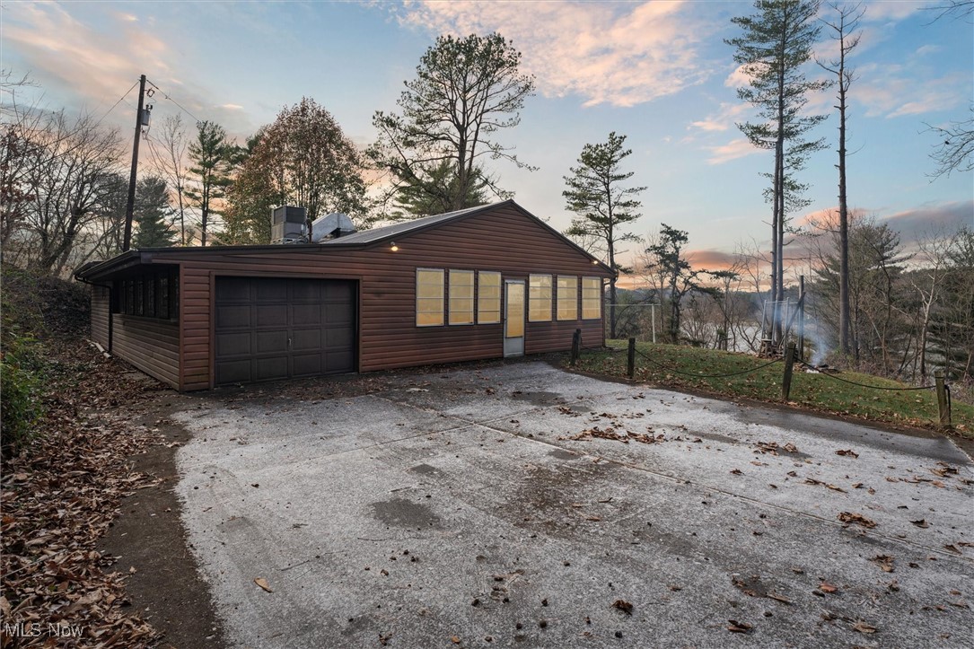 Welcome to 86413 N Bay Road, Scio, OH 43988 - Your Perfect Lake property Retreat! Discover the ultimate blend of comfort and recreation with this charming 3-bedroom, 2-bathroom ranch-style home boasting 1,228 square feet of living space and exclusive dock access to Tappan Lake. Perfectly situated in a serene, sought-after location, this property offers everything you need for lake living, whether it's a permanent residence or your weekend getaway. Step into a bright, open-concept living area with large windows that fill the space with natural light, creating a warm and inviting atmosphere. The heart of the home features ample cabinetry, modern appliances, and plenty of counter space, ideal for preparing meals after a long day on the lake. Each bedroom offers ample closet space and a cozy layout for restful nights. Enjoy Tappan Lake with ease - perfect for boating, fishing, or relaxing by the water. Tappan Lake offers 2,350 acres of water and 5,000 acres of surrounding parkland, providing endless recreational opportunities, from kayaking and swimming to hiking and camping. Conveniently located just minutes from Cadiz and nearby towns, ensuring access to dining, shopping, and local amenities while maintaining a peaceful, private setting. Don't miss this incredible opportunity to own a piece of lakeside paradise. Whether you're looking for a full-time home or a seasonal escape, 86413 N Bay Road is the perfect property to start making memories.