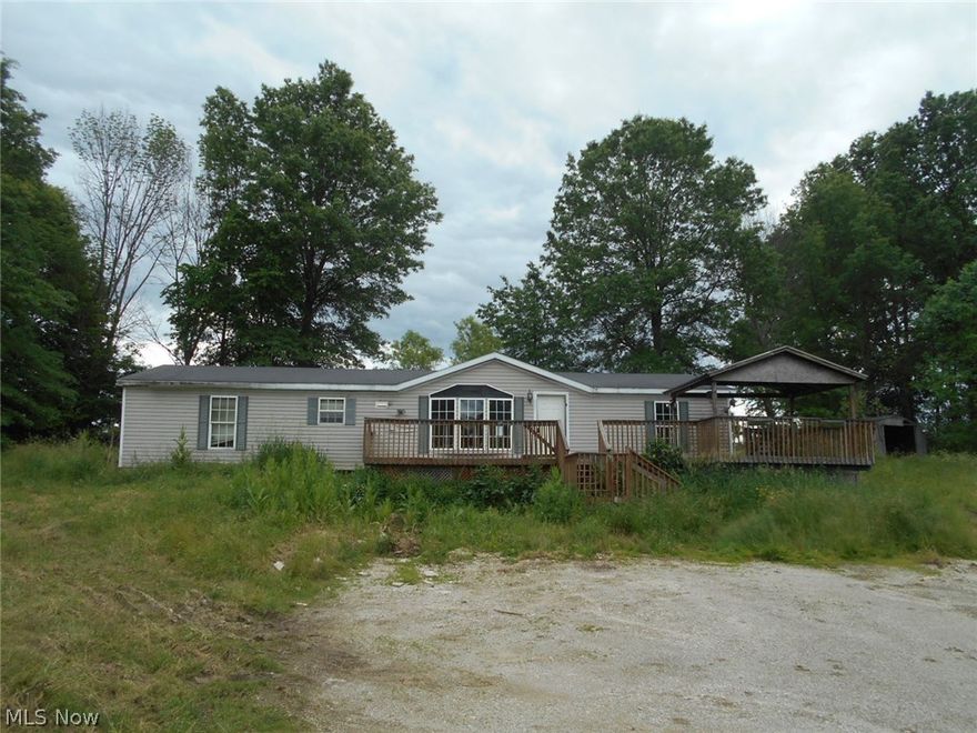 Great potential - Close to West Branch State Park - Ranch style manufactured home on 5 acres.  Three bedrooms and 2 full baths.  A portion of the property is in a flood zone. To be sold As-Is.  Buyer responsible for any city, county or other governmental certificates or inspections if required.  Property to be transfered via Special Warrnty Deed. Seller reserves the right to respond to offers within 3 business days of receipt.