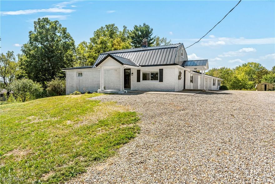This unique duplex is a rare find, offering the perfect blend of space and privacy on a sprawling 1-acre property. The front unit features a spacious two-story layout with three bedrooms, providing space for a family or guests. The modern design includes new windows that flood the interior with natural light, while the new roof ensures protection from the elements for years to come. Separating the front unit from the back is a row of three large garages, providing plenty of storage space for vehicles, tools, or recreational equipment. This convenient setup allows for easy access to both units while maintaining a sense of separation and privacy. The back unit is a charming ranch-style home with three bedrooms, ideal for those seeking single-level living or looking to downsize without sacrificing space. The updated interiors feature new furnaces and AC units, ensuring comfort and efficiency year-round. The stylish kitchens offer all new appliances, making meal prep a breeze for busy homeowners. This property is perfect for owner-occupied living in a peaceful rural setting, offering the best of both worlds with plenty of space to roam and relax. Whether you're enjoying a morning coffee on the front porch or hosting a barbecue in the backyard, this duplex provides a serene escape from the hustle and bustle of city life. Don't miss your chance to own this one-of-a-kind property with endless possibilities. With all the hard work already done, you can simply move in and start enjoying the benefits of country living in a modern and comfortable home. Schedule a showing today and experience the beauty and tranquility of this unique duplex for yourself.