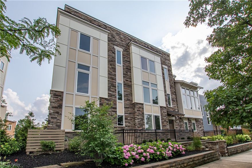 Welcome home to 3198 Van Aken Boulevard! This townhome is located on a Rapid line, moments from Shaker Square and the
historic Coventry neighborhood. Step inside at the ground level to a flex space with wood laminate floors offering access to the two-car private
garage. The main living area features a gas fireplace, spacious eat-in area, and stunning kitchen with granite counters, stainless steal appliances, bar seating, and tons of natural light. A half bath completes the main level. Upstairs, discover an oversized primary suite with a large closet and a beautiful en suite bath featuring gorgeous tile flooring, a double vanity, and an oversized shower with a glass surround. Down the hall you will find the second bedroom also with an en suite bath and a laundry room completing the third floor. Nearby the Van Aken District, University Circle, Little Italy, and an easy commute to downtown Cleveland.