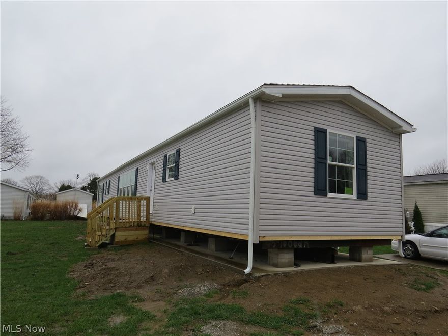 New construction single-wide manufactured home offering 3 bedrooms and 2 full bathrooms. 1140 sqft. Open-concept layout enhanced by added windows for abundant natural light. The spacious primary suite features carpet, ceiling fan, walk-in closet, and a private bath with walk-in shower and extra window. Bedrooms #2 and #3 are carpeted as well.  LVT flooring in Kitchen, Dining Area, both bathrooms, hallway and laundry area. Functional hallway desk area is ideal for home office or study space. Kitchen includes stainless steel appliances—gas range, refrigerator, microwave, and dishwasher. Home comes complete with drape package and 2” mini blinds throughout. Forced air furnace and central air included.