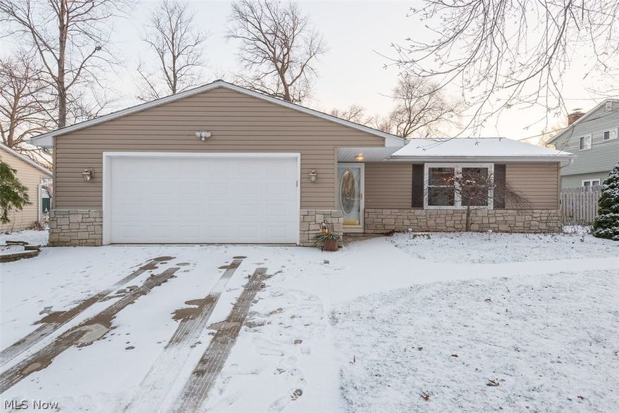 Situated in a perfect location near schools, park and highway, this 3 bedroom, 2 bathroom split level home has fresh updates making it move-in ready! Enjoy the renovated kitchen that features raised panel maple cabinets, corian countertops, oversized sink, pull-out faucet, and stainless steel appliances. Both bathrooms have also been refreshed. New flooring in the kitchen, main level and lower level. The existing wood floors upstairs were recently refinished and the home freshly painted. Outdoors a fenced in yard provides privacy for the cement patio which is  great for grilling and outdoor entertaining. The oversized shed is the perfect place for storage and a work area since there is electric running to it. Siding, windows and gutters are about 5 years old. Driveway with border, garage floor, and walkway to the back of the home are approximately 7 years old. Extra drainage added to the property. Come see today!