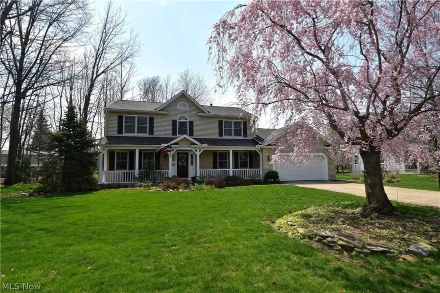 Upgraded finishes, extra living spaces, a beautiful lot, and careful maintenance make this home a must-see! Hardwood flooring in living room and dining room. First-floor office/den with built-in bookcases and cabinets. Spacious kitchen with granite countertops, peninsula, and built-in desk is open to first-floor family room. Family room has fireplace flanked by built-ins and arched windows. Sliding door to pleasant stamped-concrete patio. Large baths with granite countertops and plenty of storage space. Lower level has many finished areas--rec room with wet bar, an area with many possible uses that has a gas-log fireplace, exercise room, and half-bath. Many pluses--natural wood six-panel doors, ceiling fans, crown moldings, plantation shutters. Almost half-acre lot is beautifully landscaped. Attached two-car garage. A very lovely home!