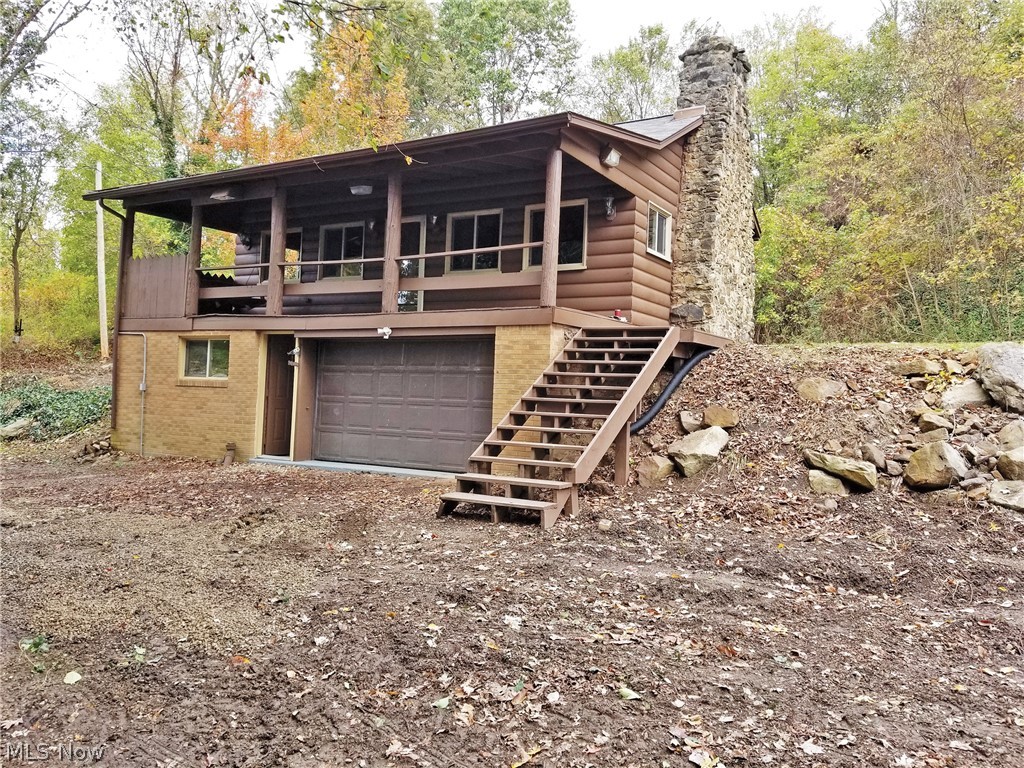 Rustic Home On 8.6 Acres Wooded Land - Jackson Twp. – Stark Co. – Jackson LSD - ABSOLUTE AUCTION, all sells to the highest bidders on location: WEDNESDAY – NOVEMBER 20, 2019 – 5:00 PM, REAL ESTATE SELLS FIRST! Real estate features a log-style home situated on 8.6 acres of wooded land. The home was built in 1930. The main floor has large great room w/ hardwood floors, stone fireplace and wood railings, eat-in kitchen, and a full bath. The lower level has 2 bedrooms, a full bath, utility room, and a 1-car garage. Covered front porch. Trails throughout property. Ideal getaway property for nature/hunting, permanent residence or build a new home in the woods! All mineral rights owned by sellers shall transfer, subject to any leases of record. Jackson Local Schools. Walk land at your convenience! TERMS ON REAL ESTATE: 10% down auction day, balance due at closing. A 10% buyer’s premium will be added to the highest bid to establish the purchase price, which goes to the seller. Any desired insp
