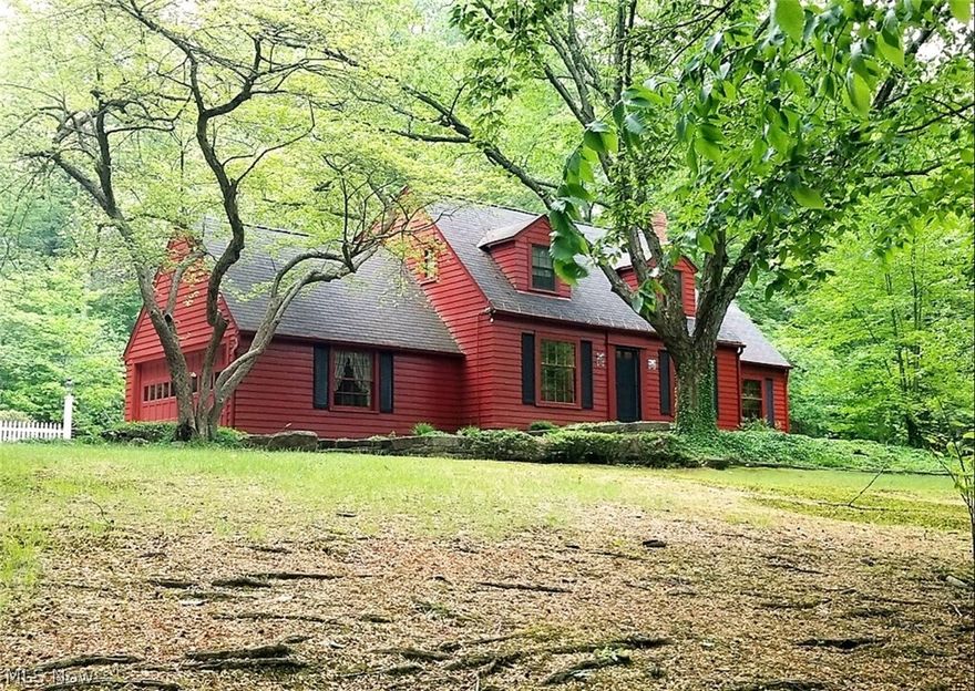 A peaceful farm house tucked away on an incredible 2.39 acre lot with plenty of privacy in the Kenston School District. On the first floor you’ll find the dining room, a family room with a fireplace, a sun-room with scenic views of the lush yard, a first floor bedroom that is currently being used as a den, and an eat-in kitchen with cherry cabinets and stone counter-tops. Two additional bedrooms and a full bath can be found on the second floor. Outside you’ll find an impressive out-building with plenty of space to accommodate your hobbies, workshop, extra car, and all of your storage needs. Other improvements include waterproofing, new insulation (2017), septic (2009), well (2004), roof (2001), and more. This beautiful home offers the best of both worlds, surrounded by abundant nature, yet only moments from freeways, shopping, grocery stores, and everything Chagrin Falls has to offer!