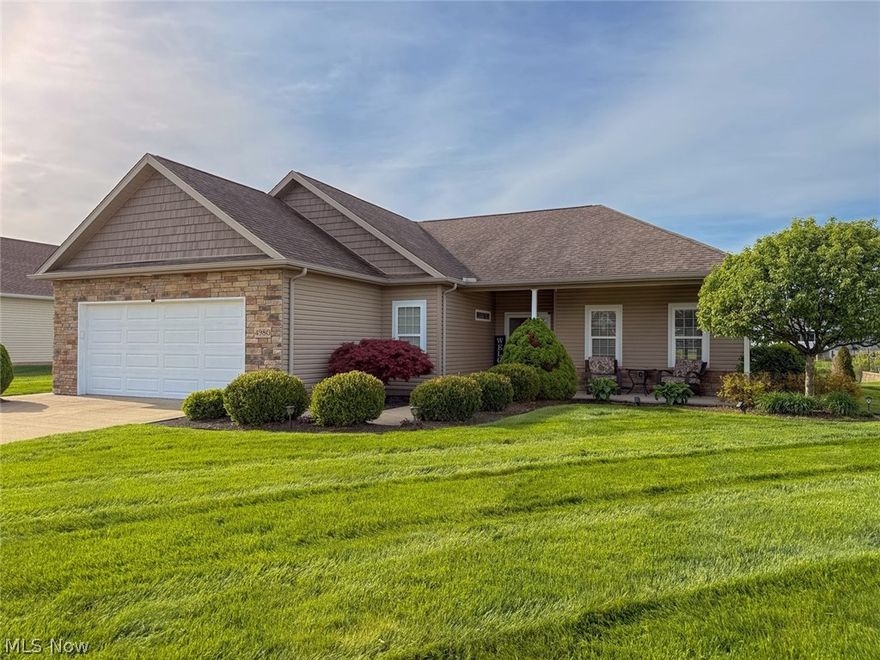 Welcome to this beautifully maintained ranch cluster home offering easy one-floor living with a peaceful lake backdrop. From the moment you arrive, you’ll appreciate the curb appeal with stone accents, shake siding, and custom house numbers built into the facade that give the home an inviting feel. Step onto the charming front porch, the perfect spot for morning coffee, then head inside to an open layout designed for everyday comfort. The spacious living room features a gas fireplace and flows seamlessly into the kitchen and dining area, creating a warm and connected space. The kitchen offers granite countertops, a pantry, and a breakfast bar for casual dining or entertaining. Just off the kitchen, you’ll find a laundry room with a transom window for natural light and a granite-topped laundry sink, with the washer and dryer included. The desirable split-bedroom floor plan provides privacy, with two bedrooms and a full bath on one side of the home and a private owner’s suite on the other. The owner’s suite is a true retreat, overlooking the lake and featuring a dual granite vanity with a built-in sit-down makeup area and a generous walk-in closet. Imagine waking up to your own peaceful water views. Step outside through the sliding glass door off the dining area to a covered back patio and take in the calming lake views, ideal for summer evenings, weekend relaxation, or hosting friends. The HOA provides access to the stocked lake, adding to the lifestyle this home offers. Additional highlights include a 2-car attached garage, a storage shed for extra space, and a slab foundation for easy maintenance with no basement. Located in the Autumn Meadows community with low annual dues and well-maintained surroundings, this home combines convenience, comfort, and a scenic setting. Just minutes to I-71 and I-76/224, with approximately a 33-minute drive to both Cleveland Hopkins and Akron-Canton airports. Immediate possession available.
