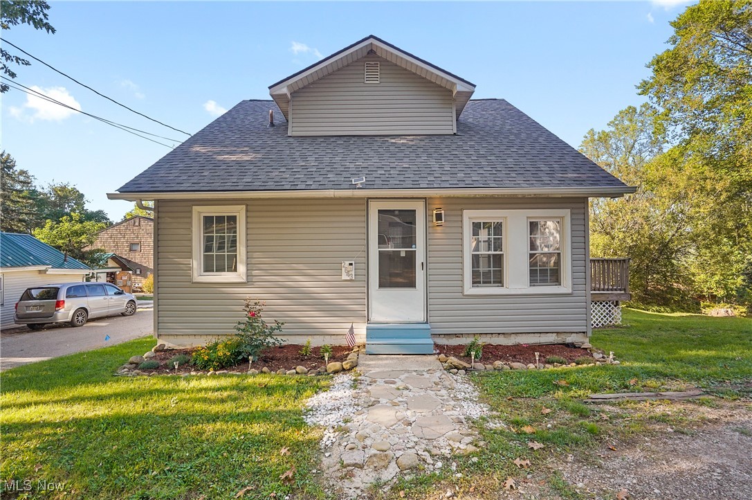 Fresh, turnkey, and loaded with big ticket updates, 2643 Monroe St in the Village of Lakemore (Springfield Local
Schools) stands out with a new roof (2024), furnace (2023), and central AC (2024) for comfort from day one. Set on a
rare double lot with an oversized two car garage, this light filled bungalow welcomes you with an enclosed entry that
opens to an airy living room flowing into the dining room and refreshed kitchen. The main level features newer LVP
flooring and a versatile first floor bedroom that also works as an office or guest space. The kitchen offers sleek gray
cabinetry, granite look laminate counters, and an oversized single bowl stainless sink, while the full bath is tastefully
updated with a tub/shower combo and a navy vanity with a crisp white top. Upstairs, two additional bedrooms provide
quiet retreats. From the kitchen, step out to an expansive newer deck overlooking the generous yard, ideal for grilling,
gardening, or unwinding outdoors. Don't wait call to schedule your private showing today!