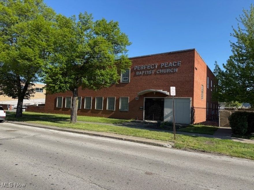 11,200 sq.ft. all brick Two Story building that was used as a Church conversion or house of worship, with multiple study rooms, break-out rooms and/or offices.  day care rooms with 2 bathrooms including kitchen area and eating area.  A total of 9 bathrooms.  One office has a walk-in closet with a full bathroom.  Baptismal bath, cafeteria.  approximately 40 parking spaces (2 lots = .50 acre).  Elevator (not currently functional), partially fenced.  This property is easily adaptable to any commercial use.  Prime location. A few blocks from Shaker Square and RTA transportation.