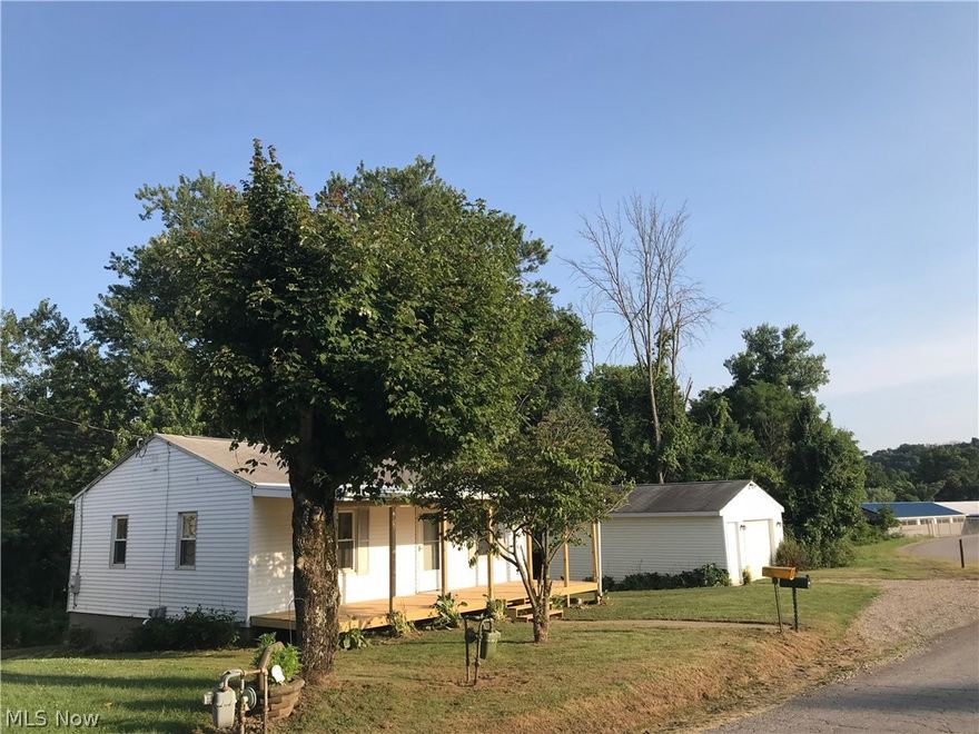 Beautiful remodeled home on 2 lots features a large yard, garage w/EO. New Furnace and air conditioning, new 8'x30' Covered deck, new dishwasher & microwave, new cabinets & countertop, new sink & commode- claw foot tub refurnished & shower unit. Seller retains Mineral Rights. This is a must see!
