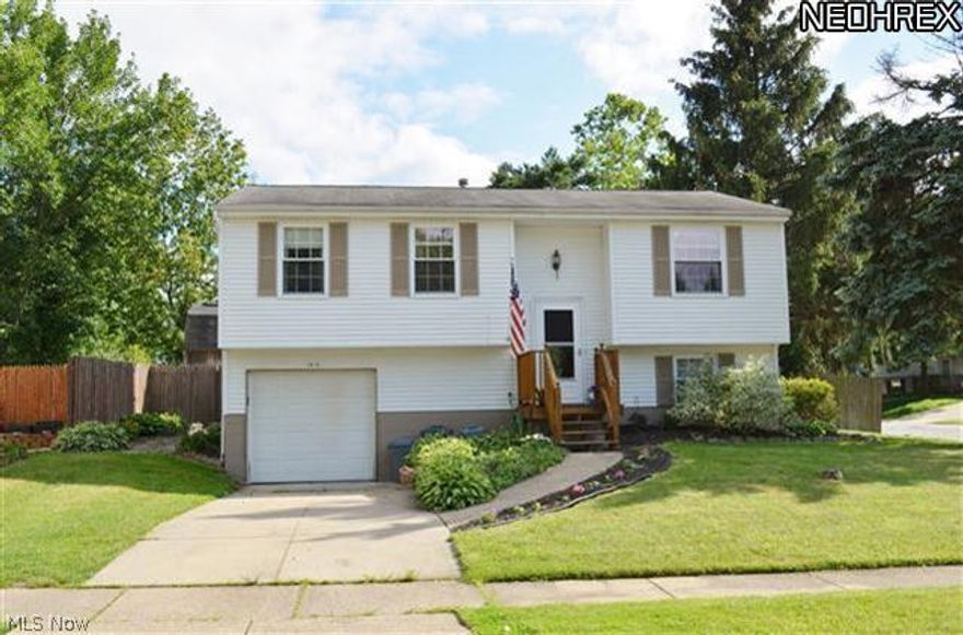 Very well maintained 3 bedroom bi-level home located on a corner lot in the Ravenna City School District.  Ceramic Foyer.  There are lots of oak kitchen cabinets including a pantry and a lazy susan.  Refrigerator, electric stove, microwave and dishwasher stay.  Kitchen also has a garbage disposal.  The kitchen and dining area have ceramic flooring for easy maintenance.  The living room and hallway have wood flooring.  Ceiling fans in two of the bedrooms.  Huge linen closet in the hallway.  The bathroom has been updated and has ceramic flooring.  The lower level of this home has a large finished family room as well as an office area with a built in desk.  Laundry area in the lower level has built in cabinets and a utility cabinet.  There is also a huge storage closet on the lower level.  Newer windows.  Relax and enjoy yourself on the backyard deck.  Great fenced in yard for privacy, small children or pets.  Use the backyard storage shed to clear the clutter from your garage.