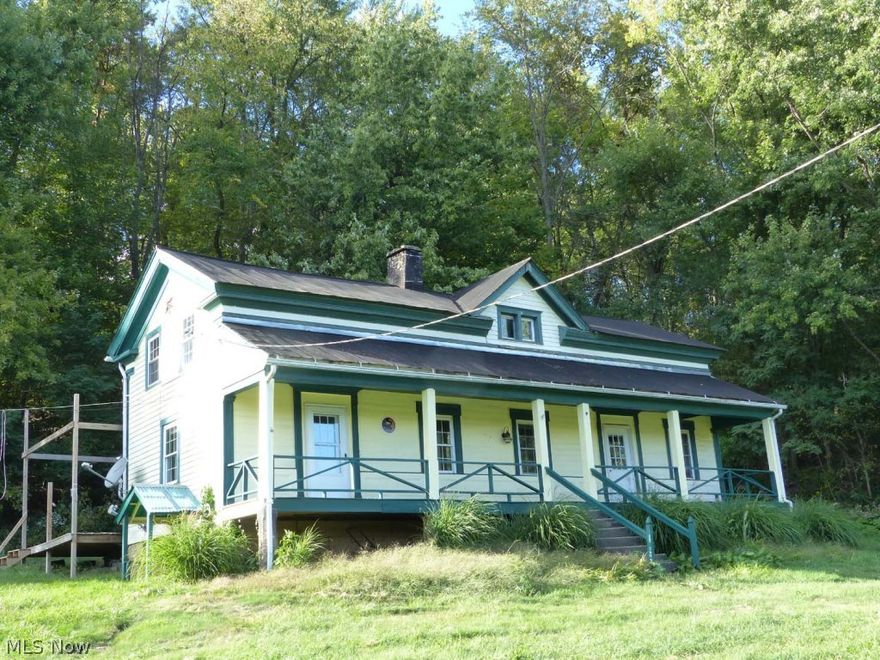 Survey is Pending.  Parcel will have a different parcel number shortly.  Remodeled farm house on 5.4 acres subject to survey with FREE GAS.  Big newer country kitchen with dishwasher plus newer first floor full bath and second story half bath, first floor laundry, replacement windows and doors.  Newer gutters and downspouts.  Newer paint and carpet.  Water conditioner is included.  Full length front sitting porch with country views plus rear deck.  Great Sandy Valley School district with brand new schools.  In Carroll County 3/4 mile from the Tuscarawas County line.  Call listing agent for details.