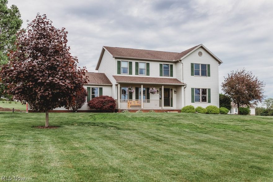 Beautifully updated home with spectacular views on just over 1 acre in a friendly neighborhood! During the warmer months enjoy the front porch with its panoramic views and barbecuing on the deck in the backyard. Inside you'll love the new wood floors throughout the entire first floor and completely updated kitchen with new cabinets, hickory counter-tops, tile backsplash, sink and stainless appliances. Enjoy the large living room with plenty of space for the entire family and dining room conveniently located off the kitchen. Upstairs you'll enjoy the master suite with large master bath and walk-in closet as well as two additional large bedrooms and bath. In the partially finished lower level there is a 4th bedroom or office space. The 3 car extended garage completes this house with a workshop wired for 200 amp service. Don's miss your chance to enjoy country living at its best!