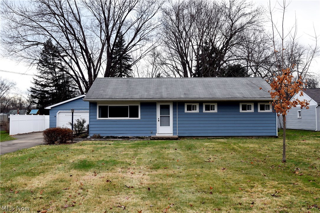 Large ranch home near Howland Township Park. This home offers a large updated kitchen with plenty of cabinets, island with breakfast bar, and appliances staying. Spacious dining area that opens to the living room with a large picture window perfect for letting in natural light. Updated main bathroom with walk-in shower. Large master bedroom with great closet space and nicely sized second bedroom. Huge family room with a brick wall fireplace, large picture window overlooking the backyard, and sliding glass door leading to the enclosed patio. Additional features include: newer windows throughout, 2 car detached garage with newer garage door and attached shed out back, concrete driveway, beautiful backyard, and so much more!