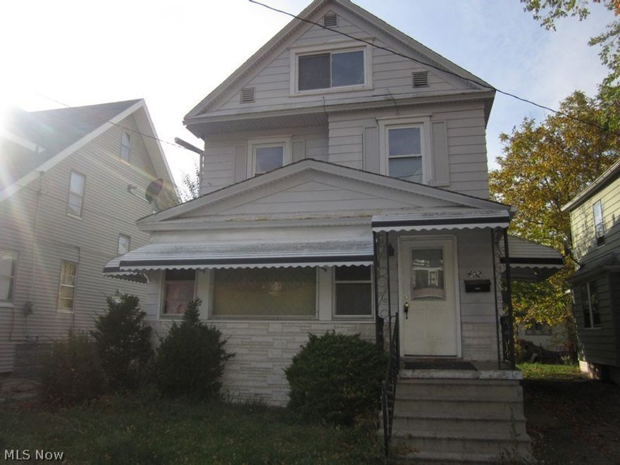 Two story duplex converted into single family. Needs work.