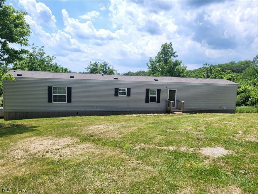 What a Beautiful piece of property over 6 acres located in East Muskingum Schools with a very well kept like new manufactured home from 2018. The home has 3 bedrooms, 2 full baths, the master bath has a walk-in shower and a garden tub and a walk-in closet in master bedroom. Beautiful kitchen with island kitchen appliances stay. New well and septic installed in 2018. So many options it would be perfect to live in the manufactured home while your dream home is being built. Also would be great for someone wanting to buy as a hunting property. Within 10 minutes of the The Wilds. Also close to public hunting and fishing.  Conveniently located minutes from I70 and I77.  Seller is very motivated! Not on a permanent foundation and has not been converted to real property.