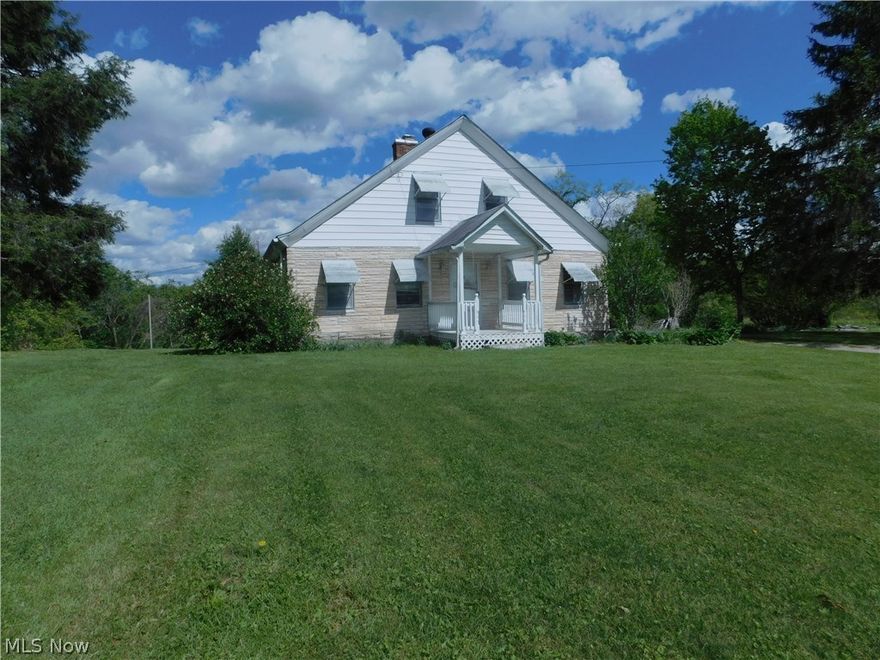 Fixer upper with spacious rooms on 5 beautiful acres in a neighborhood of many newer homes.  Seller states no deed restrictions for buyers.  Home being sold "as-is where-is" with no warranties.