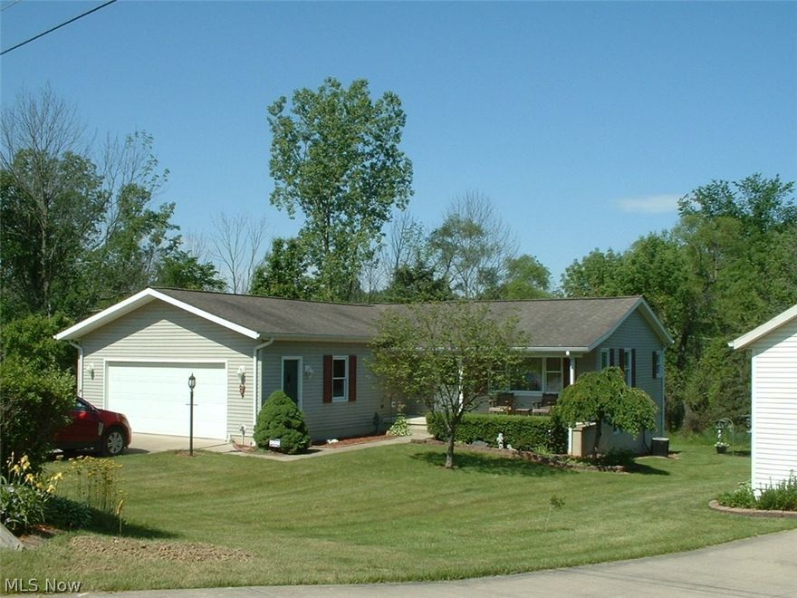 Come see this well-maintained, updated move-in-ready custom built ranch with direct access to the lake, open floor plan with master bedroom and in-suite master bath, with 2 additional bedrooms and a bath on the first floor, an updated kitchen with Corian counter tops, newer stainless steel appliances and walk-in pantry. Vaulted ceiling in the living, dining and kitchen with canned lighting. Dining area opens on to a large deck with a sun-setter shade. First floor laundry. Fourth bedroom with full bath, which could be an in-law suite on the lower walk-out level opens to a patio that overlooks wooded green space with a view of the lake, direct access to lake for boating. Lower level has a second living area, a workshop, storage area and poured concrete basement. Gated community offers swimming, fishing, a heated swimming pool, boating, tennis and basketball courts, nature trails, and lodge to enjoy as a residence or summer home. Oversized attached two car garage. Wireless security system